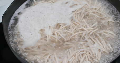 Cooking Japanese soba in kitchen