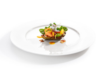 Exquisite serving avocado with mozzarella cream and dried tomato jam