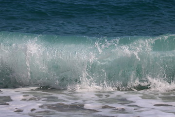 Fototapeta premium Abstract blue wave splashes in Greece