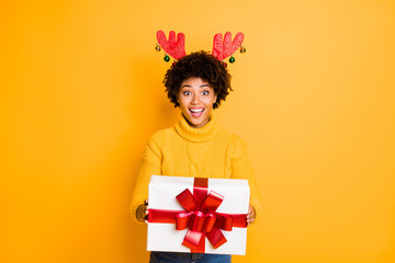 Its for you Santa helper giving package concept. Photo of pretty funny funky glad positive excited with toothy smile girl holding big white giftbox in hands isolated vivid color background