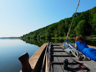 girl stern of a pleasure boat during a boat trip on the Loire River