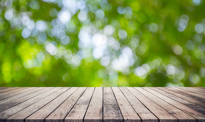 wood floor or wood desk with green bokeh for products display