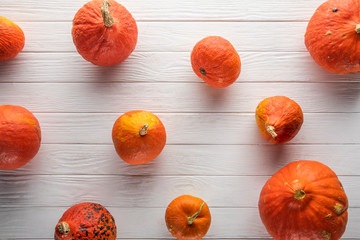 fresh picked gourds on white wooden surface 