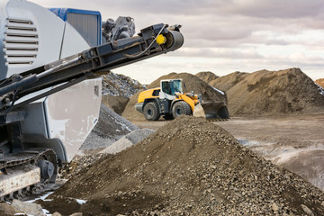 Stone crushing machine in an industrial production - obrazy, fototapety, plakaty