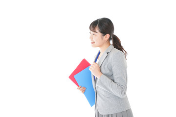 オフィスでファイルを持つ若いビジネスウーマン