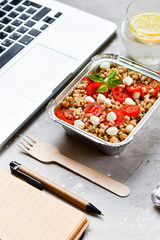 Food delivery. Lunch box with a diet lunch or breakfast or dinner on grey office table. takeaway lunch at the office. Top view . takeout healthy lunch. selective focus