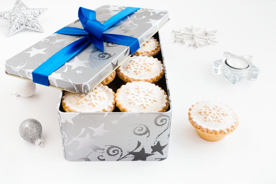 Closeup of Mince Pies in Cookie Tin with Christmas Decoration