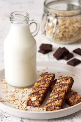 Glass of milk and Granola Bars with Chocolate