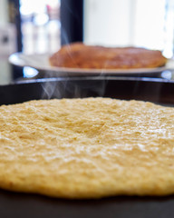 cachapas on a hot plate being prepared. corn pancakes