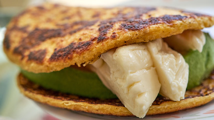 cachapa stuffed with white guayanes cheese and avocado