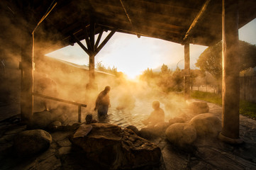 Seniors bathing in hot springs in a hot and steamy environment - obrazy, fototapety, plakaty