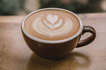 close-up coffee latte on the wood table.