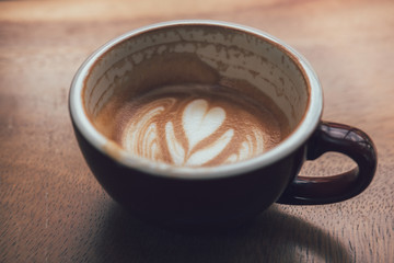 close-up coffee latte on the wood table.
