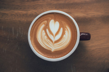 close-up coffee latte on the wood table.