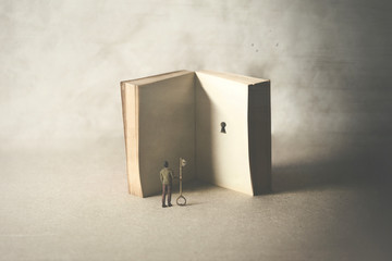 key in a book, surreal concept - obrazy, fototapety, plakaty