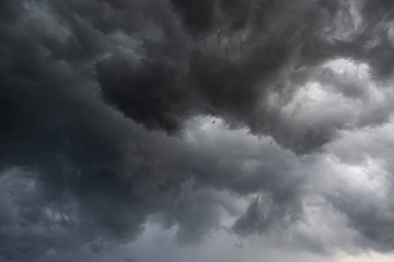 Weather in summer with black cloud and storm, Dark sky and dramatic storm clouds before rainy, Bad weather with precipitation in rainy season © peangdao