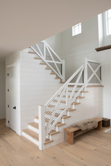 White staircase in a modern Farmhouse style interior