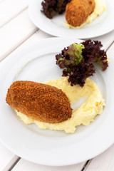 The Breaded cutlet with a mashed potatoes