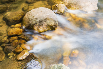 Obraz premium The water flows through the rocks.