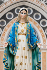 The Blessed Virgin Mary in the blue sky.