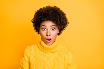 Photo of dark skin speechless lady with open mouth and eyes full fear wear warm knitted pullover isolated yellow color background