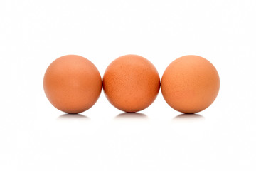 Fresh organic brown eggs isolated in white background with clipping path