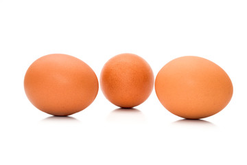 Fresh organic brown eggs isolated in white background with clipping path
