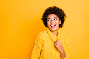 Photo of pretty dark skin lady listening humorous story wear warm knitted jumper with big collar isolated yellow color background