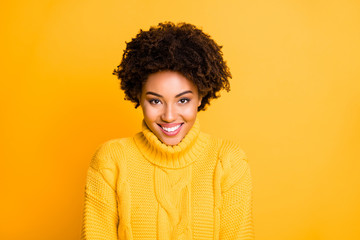 Fototapeta na wymiar Photo of amazing dark skin lady with sweet beaming smile wear warm knitted pullover isolated yellow background