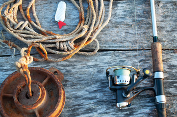 fishing tackle and accessories on wooden table