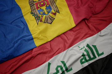waving colorful flag of iraq and national flag of moldova.