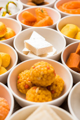 Rangoli of Assorted Indian sweets/mithai in bowl for Diwali or any other festivals, selective focus