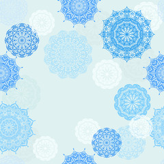 Seamless vector pattern with lace mandalas on light blue background