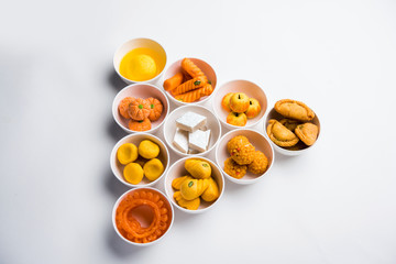 Rangoli of Assorted Indian sweets/mithai in bowl for Diwali or any other festivals, selective focus