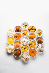 Rangoli of Assorted Indian sweets/mithai in bowl for Diwali or any other festivals, selective focus