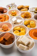Rangoli of Assorted Indian sweets/mithai in bowl for Diwali or any other festivals, selective focus