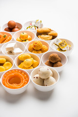 Rangoli of Assorted Indian sweets/mithai in bowl for Diwali or any other festivals, selective focus