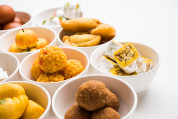 Rangoli of Assorted Indian sweets/mithai in bowl for Diwali or any other festivals, selective focus