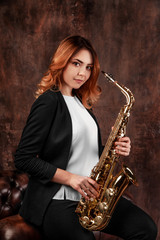 Fototapeta na wymiar girl, musician with saxophone