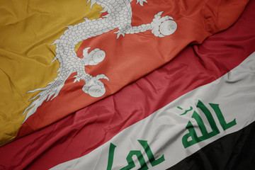 waving colorful flag of iraq and national flag of bhutan.