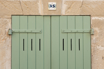 Typical Provence window with green shutters