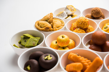 Rangoli of Assorted Indian sweets/mithai in bowl for Diwali or any other festivals, selective focus