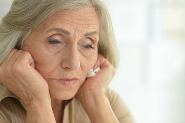 Close up portrait of sad senior woman