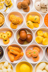 Rangoli of Assorted Indian sweets/mithai in bowl for Diwali or any other festivals, selective focus