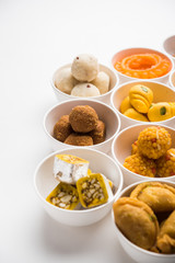 Rangoli of Assorted Indian sweets/mithai in bowl for Diwali or any other festivals, selective focus