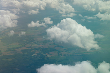 White clouds aerial view above Norwegian green landscape, Norway,