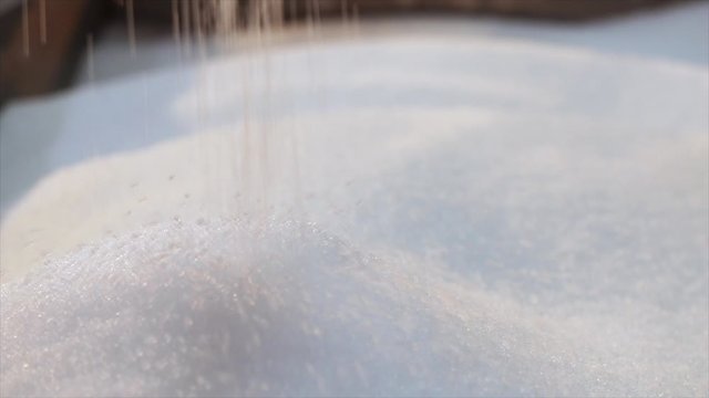 Polypropylene drop. Plastic granules fall in slow motion. Polypropylene granules closeup slowmotion