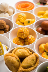 Rangoli of Assorted Indian sweets/mithai in bowl for Diwali or any other festivals, selective focus