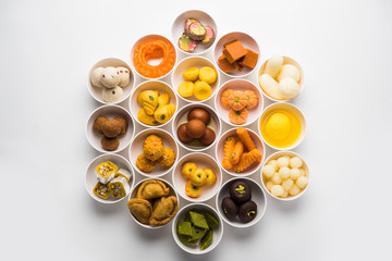 Rangoli of Assorted Indian sweets/mithai in bowl for Diwali or any other festivals, selective focus