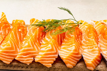 Slices of fresh salmon. Ingredient for cooking healthy seafood. Concept omega 3 containing food